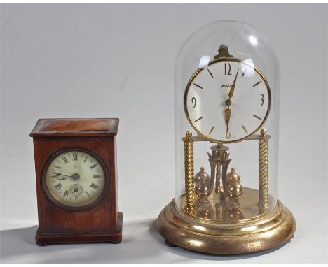 Bentima torsion pendulum clock, brass with glass dome, 32cm high with a small mahogany mantel clock, 16cm high