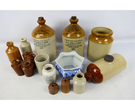 A collection of stoneware flagons, jars, pots and similar some with advertising to include Numol Body Builder and J H Jones &