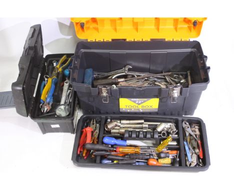 2 x plastic tool boxes containing screwdrivers, spanners, wrenches, pliers, and similar. Majority appear in used and rusted c