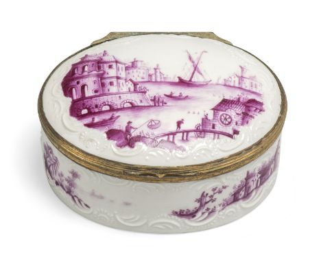 A German porcelain copper-gilt mounted oval snuff-box and cover, c.1765, the reeded mount contemporary, painted in purple cam