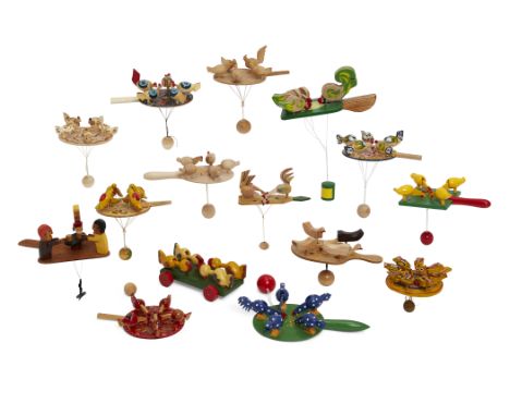 A collection of pendulum toys, late 20th / early 21st century, to include: Pecking Hens and Cockerel, Sri Lanka, painted wood