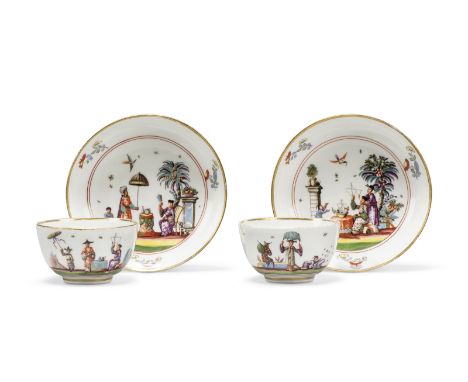 A pair of Meissen porcelain tea bowls and saucers, circa 1735, blue crossed swords marks, Drehers impressed three circles mar
