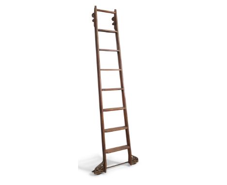An oak rolling library ladder, late 19th/early 20th century, with mounted iron wheels, 258cm high
