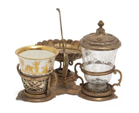 A German silver-gilt mounted porcelain and glass breakfast-set, first half 18th century, the silver with mark of Johann Heugl