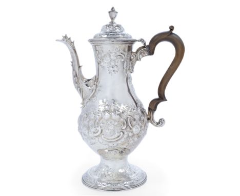 A George III silver coffee pot, London, 1783, John Kidder, of baluster form, the repousse floral scroll decorated body raised