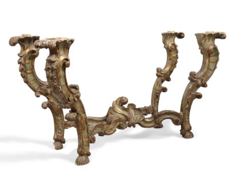 An Italian Rococo giltwood console table, third quarter 18th century, parcel green painted, the carved S-scrolling supports w