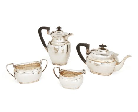 A George V four-piece silver tea set, Sheffield, 1915, Pearce & Sons, of rounded rectangular form, the pots with wooden handl