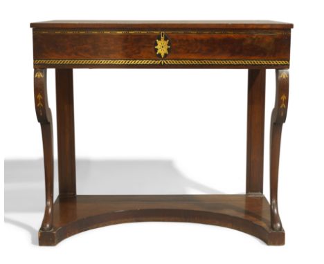 A North European mahogany dressing console table, circa 1810, ebony and brass inlaid, the hinged top enclosing camphor wood l