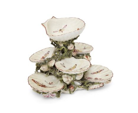 A Derby porcelain shell sweetmeat stand, c.1760-65, unmarked, with three patch marks to underside, modelled as seven scallop 