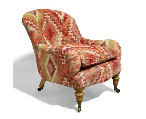 A Victorian light oak framed armchair by Gillows, c.1860, recently upholstered in a Kelim style button back fabric, raised on