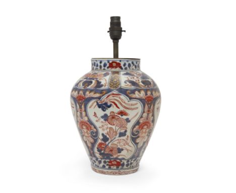 A Japanese Imari vase, first half 19th century, converted to a lamp base, decorated with panels of flowers and exotic birds, 