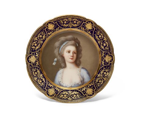 A Vienna style porcelain cabinet plate, late 19th century, blue honeycomb mark, painted to the well with a portrait of a youn