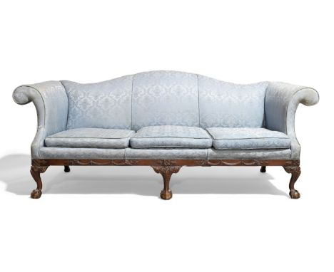 A George III style three seat camel back sofa, mid 20th century, with scroll arms and blue floral damask upholstery, the base