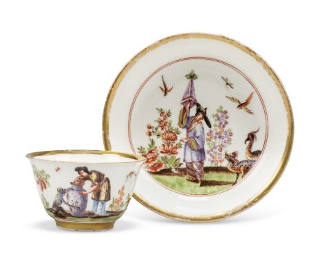 A Meissen porcelain chinoiserie tea bowl and saucer, c.1723-24, painted in the manner of J.G. Höroldt, the tea bowl with a co