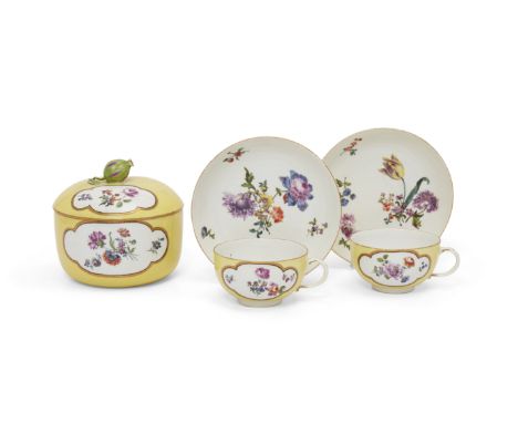 A Meissen porcelain yellow-ground part tea-service, c.1740-50, blue crossed swords marks, Pressnummern, the ground reserved w