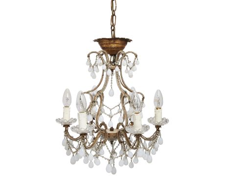 A French gilt metal and glass opaline glass six-light chandelier, late 19th century, with beaded glass mounted scrolling supp