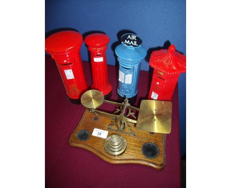 Pair of brass and oak postal scales, and four ceramic Post Box money boxes (5) 