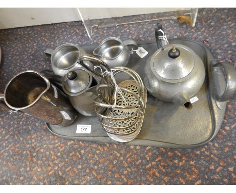 Tudric hammered pewter tea service for Liberty's, comprising teapot, hot water jug, sugar bowl, cream jug and tray, EPNS toas