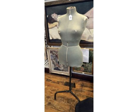 A dressmaker's mannequin (worn) 