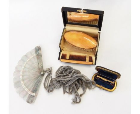 A guilloche enamel oval-shaped clothes brush with comb in original fitted box, fitted with a mirror inside the lid, various c