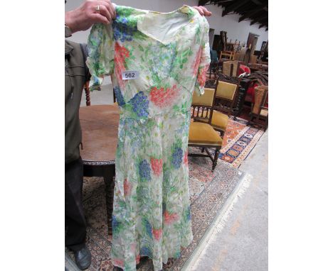  Sale Item:    2 VINTAGE DRESSES   Vat Status:   No Vat   Buyers Premium:  This lot is subject to a Buyers Premium of 15% + V