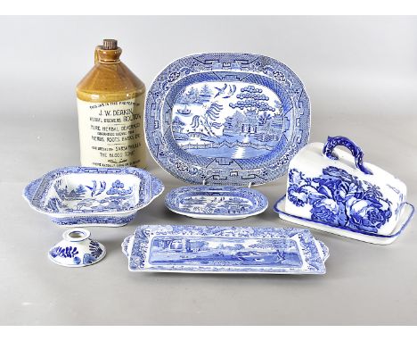 A collection of English and European blue and white ceramics, including two large willow pattern platters, another smaller, v