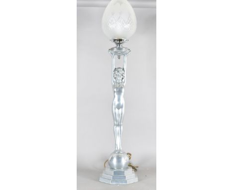 An art deco style figural lamp base, modelled as a nude holding a light aloft, 97 cm high