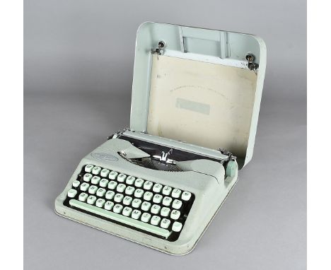 A Hermes Baby typewriter, in two tone green 