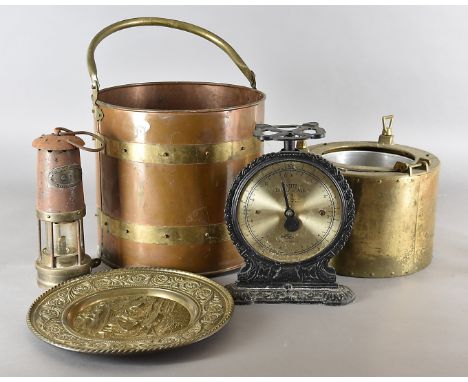 A collection of metalware, including a copper and brass log bin, a novelty ice bucket modelled as a port hole, a set of repro