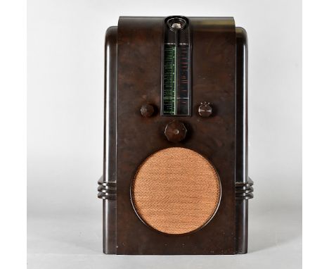 An art deco bakelite Ekco A.C 97. radio, of architectural design with central circular speaker, three faceted knobs and green