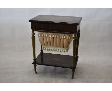 A late Victorian/ early Edwardian inlaid sewing table, having floral decoration to top and lower shelf, lift up lid to reveal