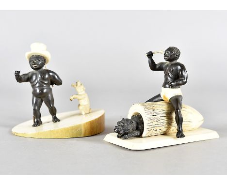 Two 19th century ivory and carved ebony figurines,  modelled as a black man seated upon a trunk with stick and dog on rectang