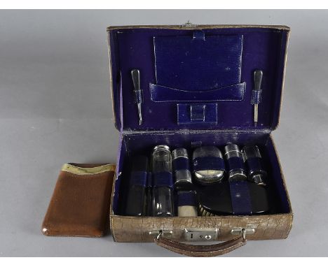 A field dressing kit, in a painted tin trunk, together with a copper and brass steriliser, a set of apothecary scales and a m