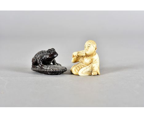 A Meiji period signed  Japanese ivory netsuke, modelled as a seated man with fan, 4 cm high, together another signed box wood