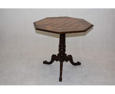 A 19th Century mahogany games table, the octagonal top, having inlaid games board, on turned support with tripod base, 62cm d