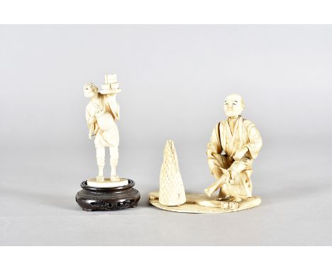 Two Meiji period Japanese ivory okimono,  one modelled as a night waiter, with lantern and tray, 10 cm high together with ano