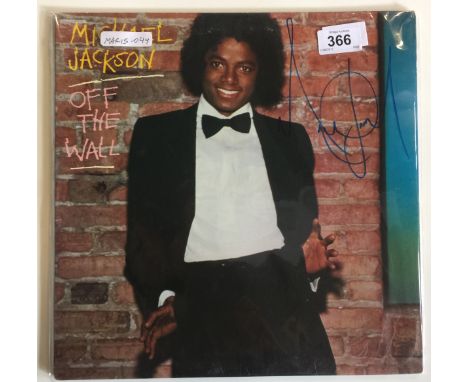 MICHAEL JACKSON SIGNED ALBUM - A Michael Jackson "Off The Wall" album cover signed in blue felt tip pen (vinyl included). Com