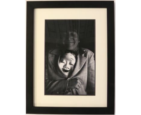 ROBERT WHITAKER (1939-2011) JOHN LENNON - framed and limited edition (no.10/75) print of John Lennon having fun with a Japane