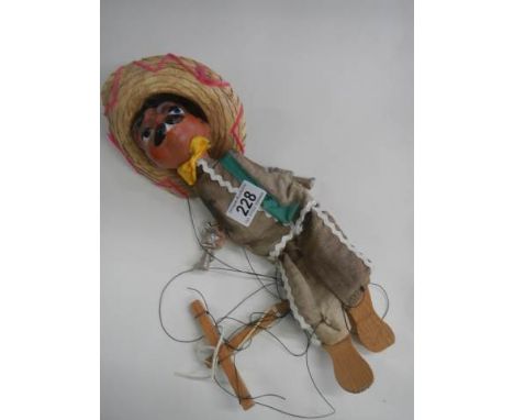 A Mexican man string puppet.
