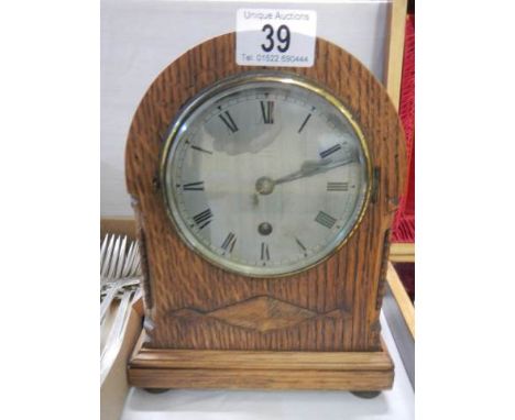 A nice oak cased mantle clock in working order.