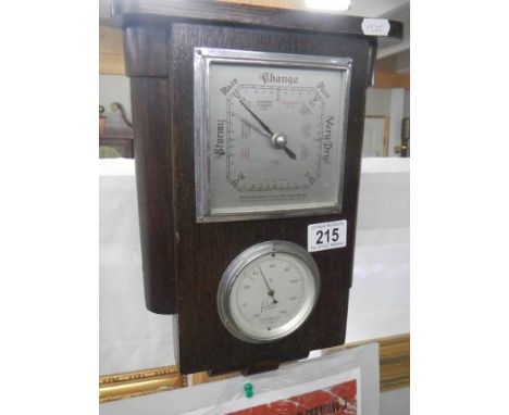 A vintage barometer/thermometer.