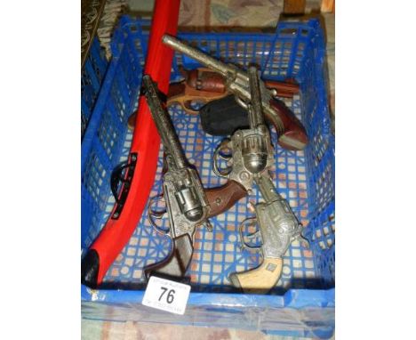 A quantity of vintage toy guns.