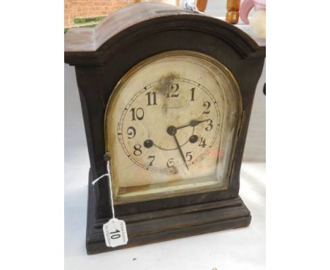 A mid 20th century mantle clock, in working order.