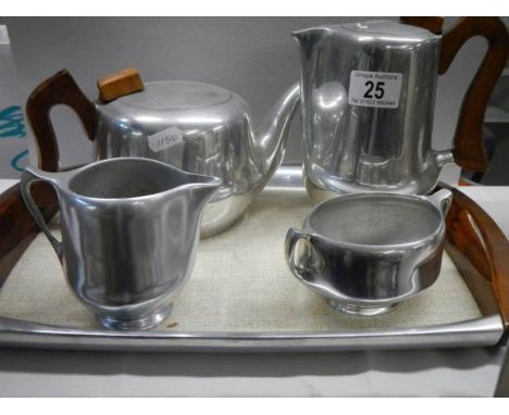 A four piece vintage Piquot ware tea set on tray.