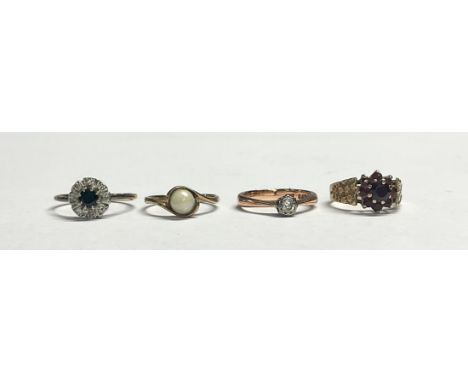 A 9ct gold diamond solitaire ring, size L, 2.6g; a 9ct gold garnet cluster ring, marked 375, 2.5g; a 9ct gold simulated pearl