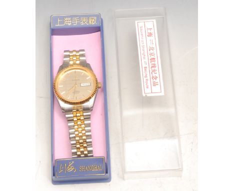 Wristwatch – steel and gilt metal automatic gentleman’s wrist watch, metallic champagne dial, gilt baton hour markers, hands 