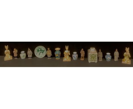 A set of three Chinese terracotta musician figures, drip glazed in green and ochre, 15cm; a set of six Chinese terracotta fig