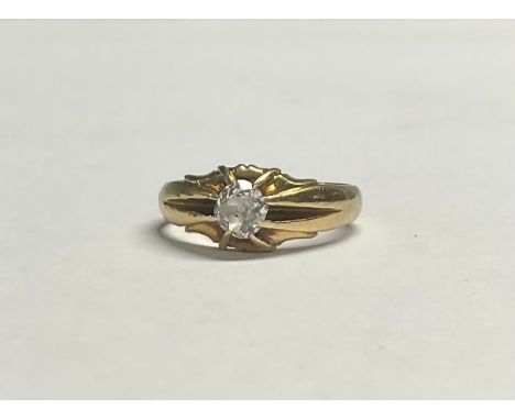 An 18ct gold "gypsy" style diamond solitaire ring, the old cut stone approx. 4mm, size M/N, marked 18ct, 4.8g 