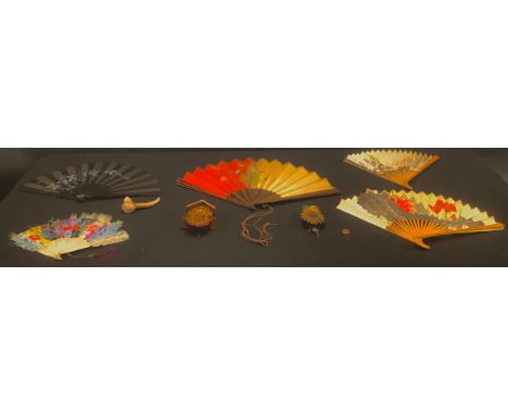 A hand painted fan, bone slats; four other fans; a miniature Black Forest cuckoo clock, 14cm; another smaller, 12cm; an anthe