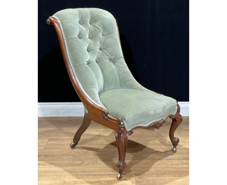 A Victorian rosewood drawing room chair, stuffed-over upholstery, deep-button back, cabriole forelegs, brass casters, 92cm hi